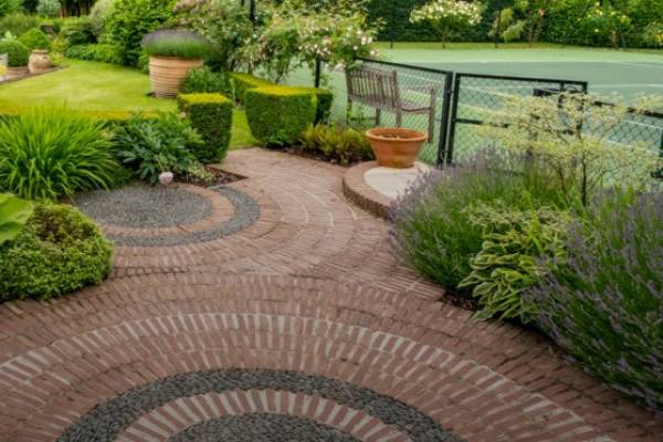 Bespoke circular brickwork on a garden patio.